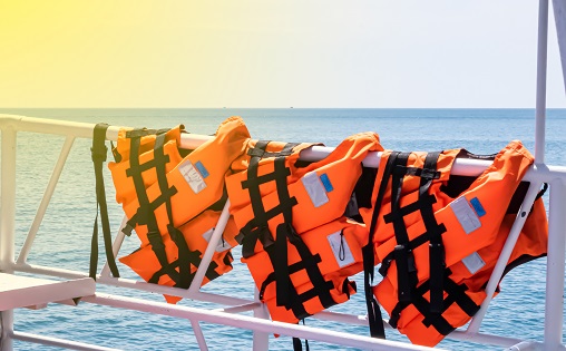 Life jackets or personal flotation devices  for safety equipment for anyone on a boat, especially in open water.