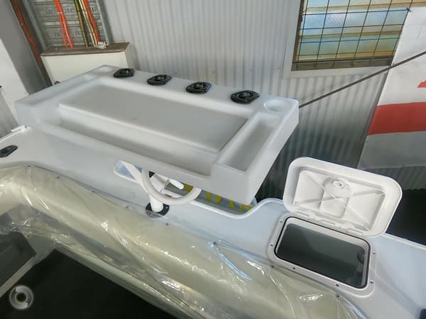 white and big biat board and a live bait storage beside